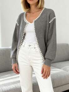 纯色开衫，珍珠饰边做旧下摆，长袖，优雅针织毛衣