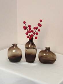 一套1个不对称几何玻璃花瓶，瓶口小巧，渐变棕色。适合家居客厅或玄关装饰，也是返校季房间装饰和文具收纳的理想花瓶。冬季装饰佳品。可用于浴室、卧室、商店、展览、派对等场合。复古、简约、北欧、中性、高端、时尚。情人节、新年、斋月或开斋节的完美之选。 - 棕色 - 查看 4