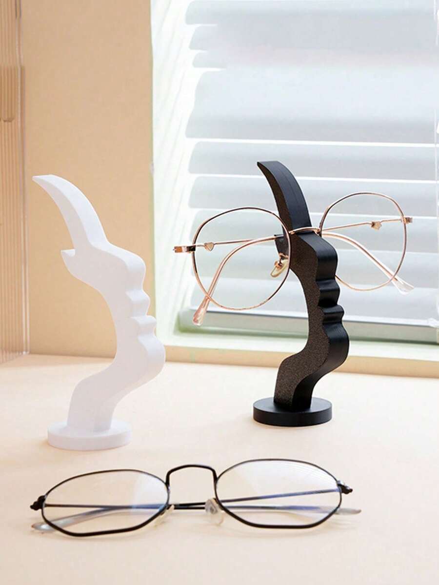 Support de lunettes en forme de profil, design incurvé unique, matériau en plastique, fonction de rangement artistique, rehausse la décoration du bureau ou de la table de nuit, design minimaliste et pratique en noir, cadeau de fête