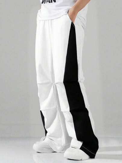 1件青少年男童休闲街头风宽松撞色滚边阔腿裤，适合度假、春夏穿着。