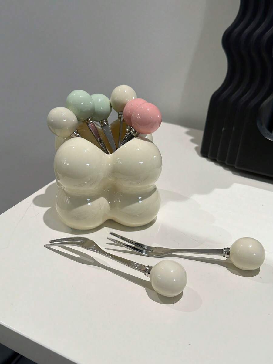 1个家用水果叉收纳罐，简约优雅，可作咖啡和茶具装饰品。作为装饰品，它可用于家居装饰、室内装饰、茶室装饰、办公室装饰和婚礼装饰。