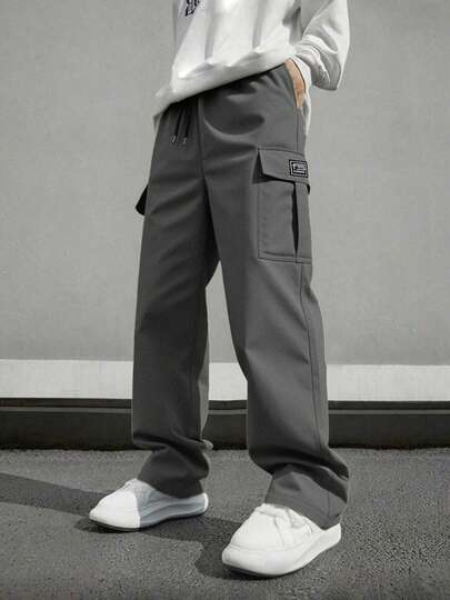 男士休闲工装裤，宽松直筒版型，垂感好，适合居家休闲和户外活动，也是情侣送礼佳品。采用100%涤纶面料，配有抽绳腰带，可调节松紧，多种颜色可选。