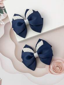 2入組小女童人造珍珠和蝴蝶結裝飾髮夾