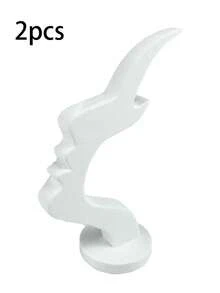 1个侧脸造型眼镜架，独特的弧形设计，塑料材质，兼具艺术收纳功能，可提升桌面或床头柜的装饰格调，简约实用的黑色设计，节日/圣诞礼物之选。