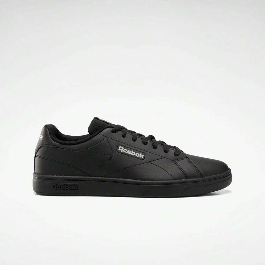 Tenis Reebok Court Clean para hombre y mujer, el calzado esencial que combina una estética limpia con la versatilidad necesaria para tu día a día. Estos tenis de silueta de perfil bajo están diseñados para ofrecer un look sofisticado y relajado, ideales para combinar con cualquier atuendo casual. Están fabricados con una parte superior de piel sintética suave y duradera, que proporciona un ajuste cómodo y una apariencia premium. Cuentan con una suela de goma tipo cupsole de alta resistencia que garantiza una tracción estable, junto con una plantilla acolchada que ofrece una amortiguación ligera en cada paso. Su diseño  con el logotipo de Reebok sutilmente grabado en el lateral resalta su enfoque minimalista y elegante, convirtiéndolos en la elección perfecta para quienes valoran la simplicidad, la calidad y el legado deportivo en un calzado contemporáneo y unisex. - Negro - Ver 1