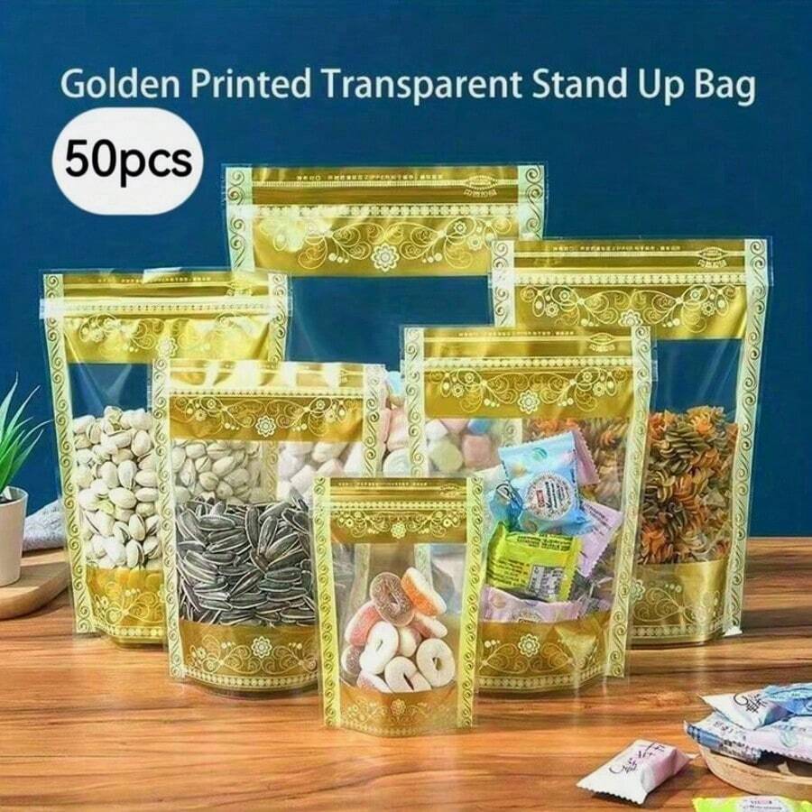 50个优雅金色花卉印花透明金色拉链自立袋 - 可重复使用的PET塑料食品包装袋，适用于茶叶、干果、坚果等 - 非常适合厨房收纳、礼品包装和礼品赠送 | 透明窗口袋 | 耐用拉链封口 - 金色 - 查看 1