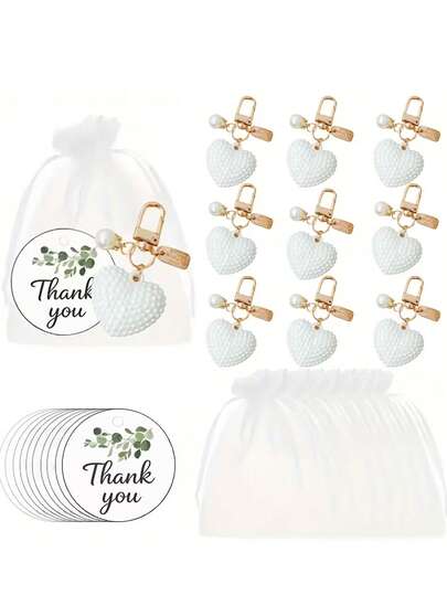 30/15 piezas Juego de llaveros con forma de corazón de perlas, incluye 5 llaveros, 5 tarjetas de agradecimiento y 5 bolsas de organza. Presenta decoración de corazón de perla hueca, encantos de bolsa, adecuado como recuerdos de fiesta. Perfecto para el Día de San Valentín, recuerdos de boda, regalos de banquete, recuerdos de despedida de soltera, regalos del Día de la Madre y otros regalos de fiesta.