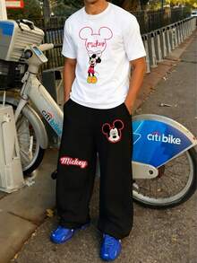 Disney Valentine's Day Pajama Gift Set. Men's Apparel. Mickey Mouse Graphic Tee With Mickey Shaped Ring Pattern. White Short Sleeve T-Shirt Paired With Black Casual Sweatpants. Men's 2-Piece Set. Men's Autumn Outfit - Black and White - View 2
