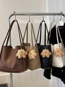 这款女士大容量手提包/单肩包/手提包采用PU材质，配有星星毛绒吊坠，简约的纯色拼接设计，适合日常通勤、商务旅行，也是送给女朋友的绝佳礼物，是女士秋季穿搭的理想之选。 - 彩色 - 查看 3