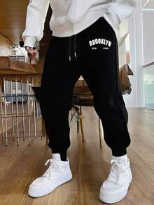 男士纯色简约针织裤，时尚百搭，适合运动和休闲场合，款式多样，穿着舒适。女士们可以把它作为礼物送给男友或丈夫，这将是一份很棒的礼物。 - 黑色 - 查看 6