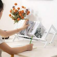 1个桌面小书架，用于存放书籍、杂志和其他物品，可放置在书桌、办公桌、客厅桌子上，帮助整理桌面，节省空间，保持物品整洁有序，适合学生、上班族和家庭日常使用。 - 彩色 - 查看 6