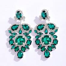Boucles d'oreilles pendantes exagérées avec perroquet, strass colorés et pompons pour femmes. Boucles d'oreilles de style européen et américain de luxe et tendance.
