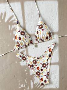 Elegantes rückenfreies Binde-Strandkleid mit Blumen- und Blätterdruck für den Urlaub