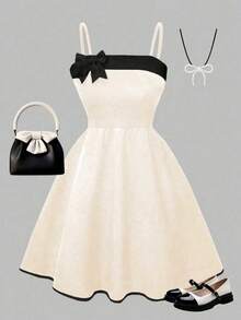 Chiếc đầm hè thanh lịch và thời trang dành cho bé gái này có thiết kế phối màu đen trắng cổ điển với dây đeo vai thắt nơ. Thích hợp cho sinh nhật, tiệc tùng, du lịch ngoài trời hàng ngày, và cũng là một món quà tuyệt vời dành cho trẻ em. - Màu be - Xem 1