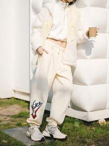 Nike Women's Logo Print Training Knit Sweatpants, - Off White - View 1