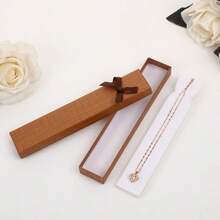 Caixa de joias com laço longo, elegante e requintada (1 unidade), ideal para guardar pequenos presentes como colares, pulseiras, relógios, etc. Perfeita para ocasiões como Dia das Mães, Dia dos Professores, Dia dos Namorados, Dia dos Pais, formatura, presentes para amigas, namoradas e lembrancinhas (o laço é colado manualmente e pode apresentar pequenos resíduos de cola que não afetam o uso. Caso isso seja um problema, tenha cuidado). [Estilo aleatório] - Multicolorido - Ver 7