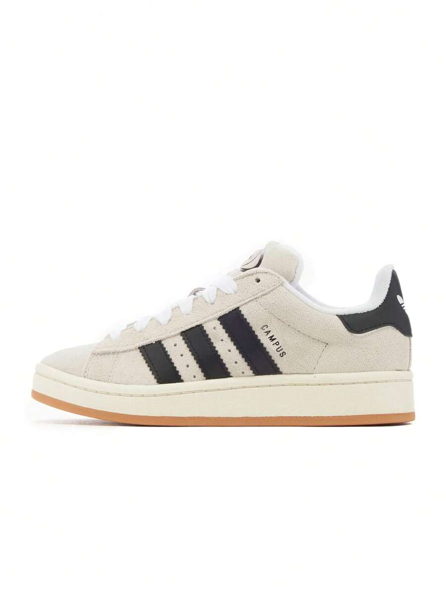 Adidas Campus 80s运动鞋融合了2000年代经典的滑板文化，并以现代的比例重新诠释，打造出既时尚又经典的造型。这款休闲运动鞋采用常规版型和系带设计。 - 水晶白 - 查看 1