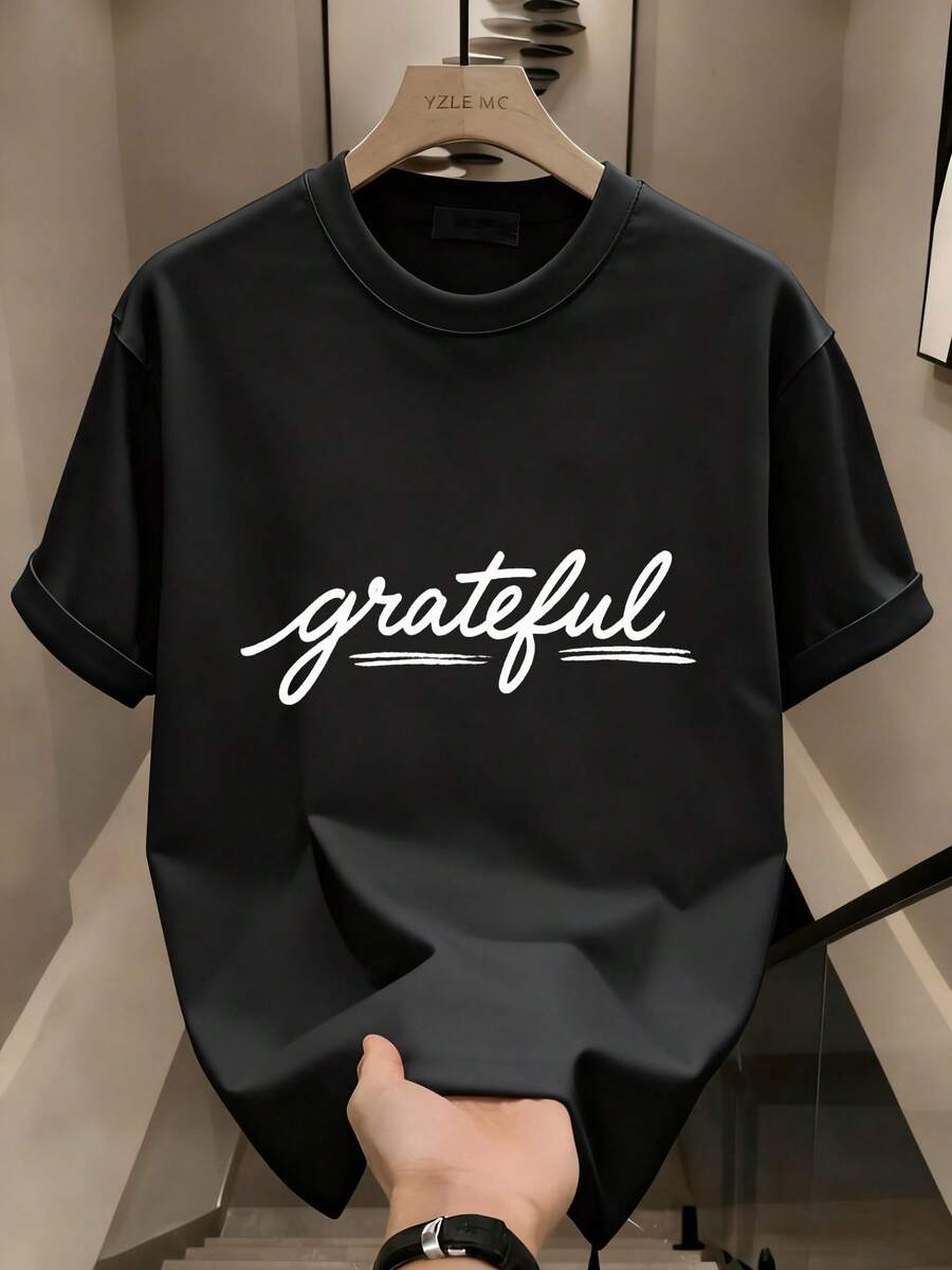 Camiseta de manga corta de algodón impresa y transpirable para hombres, duradera y versátil para el estilo urbano. AQBP - Negro - Ver 1