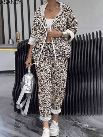 Conjunto de pantalones de mujer talla grande vendidos para otoño e invierno - Parte superior con capucha de estampado aleatorio y pantalones rectos, conjunto casual para uso diario