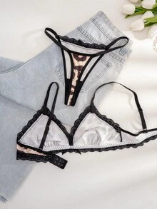 1 conjunto de lencería sexy con sostén y tanga con patchwork de encaje negro y estampado de leopardo con lazo - Negro - Ver 3