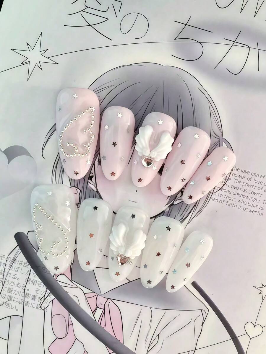 Bộ 10 miếng dán móng tay hình bầu dục màu hồng pastel và trắng, trang trí sao bạc, cánh trắng 3D, pha lê hình trái tim và hạt kim loại, phong cách Kawaii ngọt ngào và Lolita, kèm keo dán móng mini và dũa móng. - Follow Your Heart - Xem 1