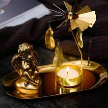 这款旋转金色烛台饰有风车和月亮造型，适合作为万圣节和圣诞节礼物。旋转烛台（不含蜡烛）。这款金色旋转烛台可营造浪漫的婚礼、圣诞派对或餐桌装饰氛围。节日礼物（款式随机），适合斋月、中东和穆斯林使用。 - 金色 - 查看 4