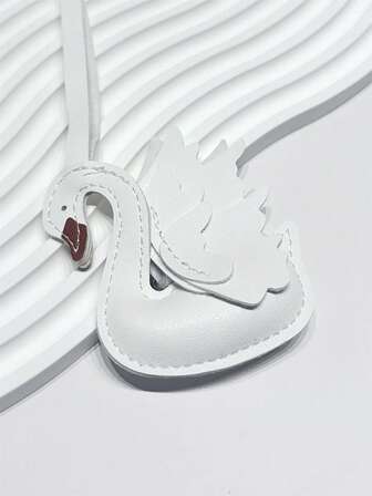 1 pieza Colgante de cisne de PU con temperamento elegante y de moda, simple y versátil, personalizado, lindo y divertido colgante con forma de animal para mochila, bolso de hombro, bolso cruzado, bolso de mano, bolso de tela, bolso de sobaco, bolso de maquillaje u otros bolsos de almacenamiento, colgante para coche, llavero, colgante para cintura de pantalones