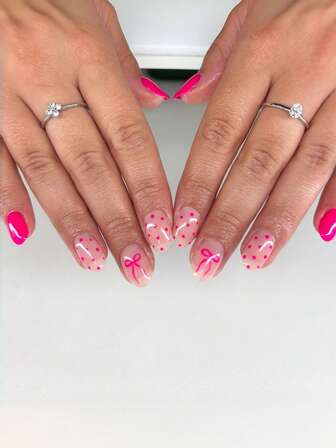 24片椭圆形美甲贴纸，饰以简约蝴蝶结和玫瑰红波点。本套装包含亚克力美甲贴纸，适合女士约会、派对、日常工作、情人节礼物等场合，增添您的魅力。