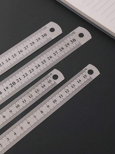 1支/10支装学生尺 30厘米、20厘米、15厘米不锈钢尺，耐用金属尺，适用于木工、学生，绘图的精确测量工具，简约黑白设计（部分产品在生产过程中可能存在轻微划痕，此属正常现象，不影响产品使用）。