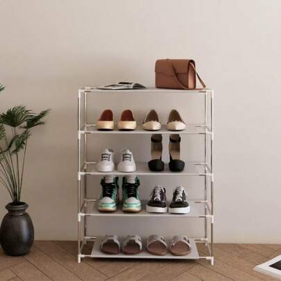 A Simple, Multi-Tiered, Space-Saving Metal Shoe Rack, Floor-Mounted, Suitable For Various Room Types.