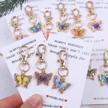 12个“拥抱与爱”口袋拥抱代币，口袋拥抱卡片。附赠励志蝴蝶钥匙扣套装，适合装饰背包、手提包和车钥匙，男女皆宜。这款独特的魅力礼物充满激励和鼓舞，适合任何需要支持和肯定的人。也可作为纪念礼物、友谊礼物、情人节礼物、返校礼物和毕业礼物。 - 彩色 - 查看 5