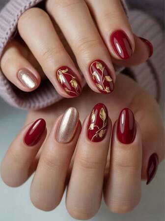 24 piezas de uñas postizas de forma ovalada corta, color rojo burdeos brillante con hojas doradas brillantes y efecto champán