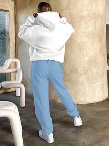 Looking For An Outfit That's Laid-Back Yet Full Of Empowering Charm? This Slogan Set Collection Is Your Perfect Pick! Soft Hues Like Brown, Light Blue, And Green Bring A Cozy Vibe, While The Hoodie Design Wraps You In Casual Ease. The "STRONGER Than The Storm" Slogan Quietly Carries A Sense Of Confidence. The Relaxed Fit Flatters All Body Types-Pair It With Sneakers For A Fresh Street Look, Or Slip On Slippers For Cozy At-Home Style Without Losing Polish. No Need To Mix And Match; Slipping On The Set Lets You Easily Capture The Comfort And Warmth Of An American Girl's Vibe, Keeping Every Day Stylish And Delightfully Empowering. - Màu xanh lam - Xem 2