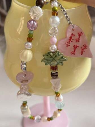 Colgante de cuerda para teléfono con cámara CCD en forma de corazón de concha de coco, pieza colgante anti-liberación, cuerda de cuentas DIY