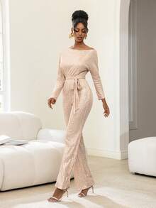 Faeriesty Bộ jumpsuit dài tay bất đối xứng độc đáo này có thiết kế đính sequin lấp lánh, kết hợp với thắt lưng nơ bằng satin và kiểu dáng ống rộng, là lựa chọn lý tưởng cho các sự kiện theo chủ đề vũ trường, dạ tiệc thảm đỏ, tiệc thời trang và lễ kỷ niệm Ngày Valentine. - Rượu sâm banh - Xem 9