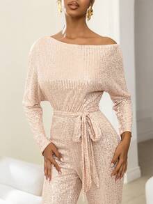 Faeriesty Bộ jumpsuit dài tay bất đối xứng độc đáo này có thiết kế đính sequin lấp lánh, kết hợp với thắt lưng nơ bằng satin và kiểu dáng ống rộng, là lựa chọn lý tưởng cho các sự kiện theo chủ đề vũ trường, dạ tiệc thảm đỏ, tiệc thời trang và lễ kỷ niệm Ngày Valentine. - Rượu sâm banh - Xem 6