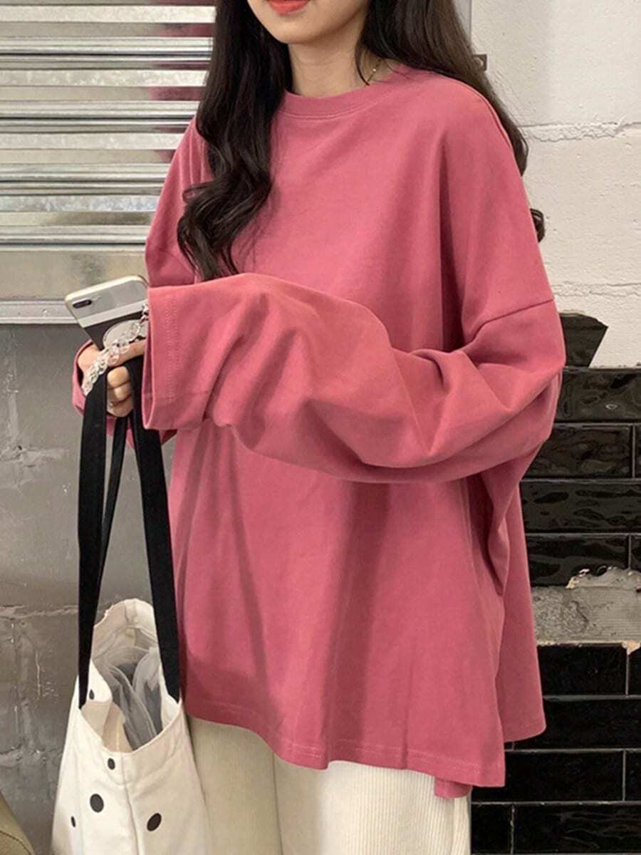 Camiseta de manga larga con dobladillo dividido y color liso para mujer. Prenda interior de moda. Estilo coreano. Prenda exterior moderna para estudiantes. Top holgado. - Rosa - Ver 1
