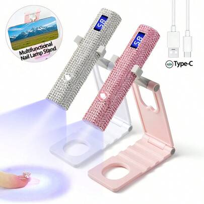 1个USB充电式镶钻手持LED美甲灯，带液晶显示屏，便携式迷你美甲烘干机，饰有白色/粉色钻石，适用于凝胶指甲油，配备高效LED灯泡、5倍放大镜、美甲灯支架和180mAh锂电池，持久耐用，快速高效地固化指甲。