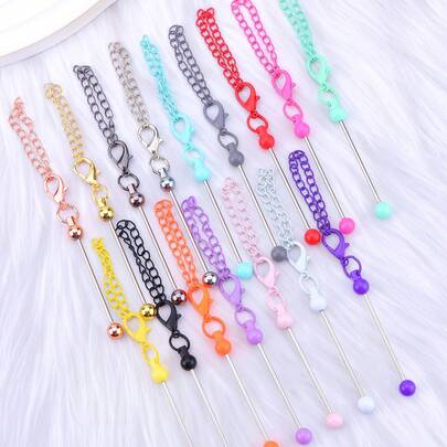10合1 DIY钥匙扣配件套装，包含珠宝制作工具、彩色钥匙扣链、创意吊坠材料、硅胶珠和装饰珠。