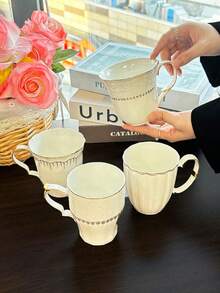 1pc European Style Embossed White Ceramic Gold Rim Mug With Handle, Coffee Cup, Breakfast Milk Cup, Home Afternoon Tea Latte Art Cup, Juice Beverage Cup, Couple Water Cup, Christmas Holiday Gift, Gift For Family And Friends - White - View 2