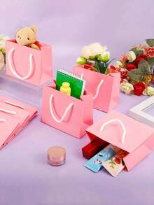 20个迷你粉色带提手礼品袋 - 适合手工爱好者、派对策划师、送礼者，可用于婚礼、生日、派对、手工制作、礼品和珠宝收纳 - 粉色牛皮纸（4x5x2英寸）中小型派对礼品袋 - 彩色 - 查看 4