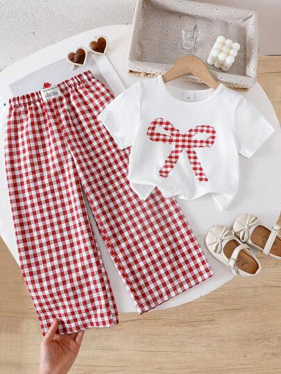 Set de 2 piezas para niñas jóvenes con camiseta de manga corta con gráfico de lazo y unicolor, y pantalones a cuadros coloridos de moda, adecuado para uso diario casual, al aire libre, fiesta, primavera/verano/otoño