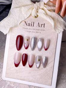 10片手工制作的按压式美甲片，短杏仁形假指甲，法式美甲，Y2K风格可爱美甲，红白相间，饰有闪亮银色猫眼和金色蝴蝶结，优雅精致的风格，适合女士和女孩在节日和活动中使用，附赠美甲工具。 - 紅色 - 查看 12