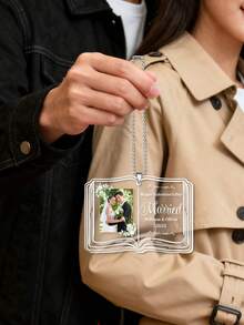 Personalized Custom Couple Ornament​ – Book-Shaped Acrylic Keepsake With Custom Photo Slot And Engraved Text. Features Floral Borders, Silver Chain, And Transparent Background. A Sentimental Gift For Newlyweds Like William & Olivia, Couples, And Valentine's Day Celebrants. Ideal For Car Mirrors, Christmas Trees, Or Bedside Displays To Cherish Love Stories.