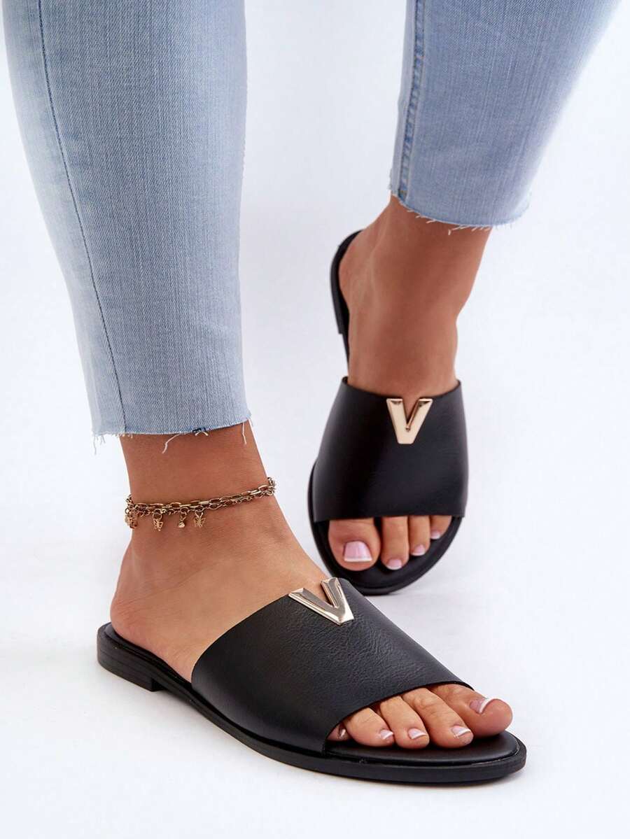 Mules plates  synthétique pour femmes Maliha avec élément doré décoratif. Parfait pour les jours d'été et de nombreuses occasions. Or, marron, noir, blanc - Noir - Voir 1