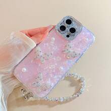 غطاء هاتف وردي اللون بنقشة قوقعة ثلاثية الأبعاد مع حزام معصم متوافق مع أجهزة 17 برو ماكس/17 برو/17، 16 برو ماكس/16 برو/16، 15 برو ماكس/15 برو/15، 14 برو ماكس/14 برو/13 الجديدة