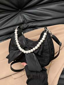 一款可爱百搭的斜挎包，配有蝴蝶结、珍珠尼龙拉链，适合日常使用。拉链设计，可调节肩带，适合上学和旅行，可轻松容纳日常必需品。这款多功能单品时尚百搭，适合各种风格和场合，具有很强的风格适应性。 - 黑色 - 查看 2