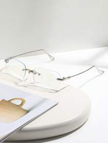 一副轻便无框时尚眼镜，金属框和PC框可选，适合日常通勤。适合长时间使用电脑、手机、屏幕，也可作为配饰佩戴。 - 透明片 - 查看 2