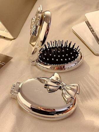 1 pieza Cepillo de pelo mini con forma de mariposa y espejo, cerdas de nailon, mango de plástico ABS, cepillo plegable y portátil con cojín de aire, adecuado para cabello normal, herramienta de peinado amigable para viajar para mujeres