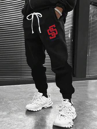 Pantalones jogger negros de talla grande para hombres, pantalones deportivos casuales sueltos con estampado de marca para uso al aire libre